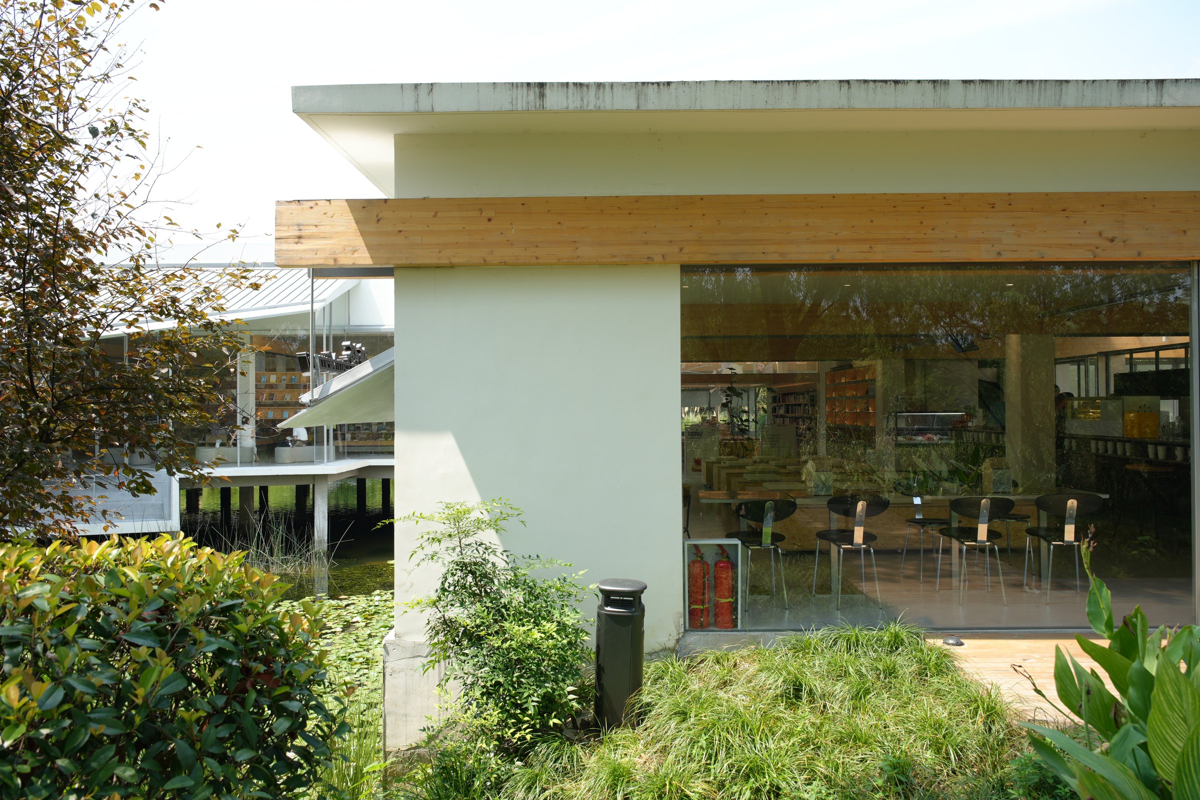 Ecotrap-100 installed beside established planting, a water feature and an outdoor hospitality space in Australia